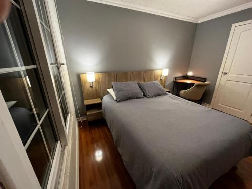 a bedroom with a bed with two pillows on it at APARTAMENTO PROVIDENCIA in Santiago