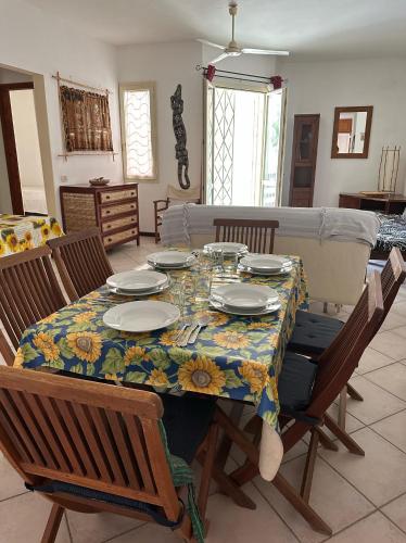 a dining room table with a floral table cloth on it at KatlantiK Estoril Deluxe in Sal Rei