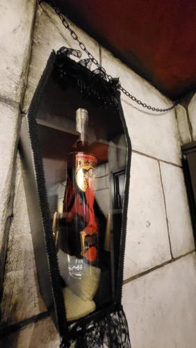 a bottle of alcohol in a mirror on a wall at Transylvania House in York