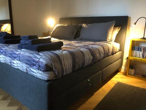 a large bed in a room with at sonnino house in Pisa