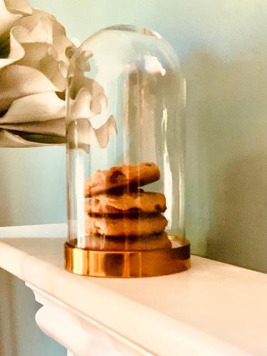 a table with a glass jar with cookies in it at The Nutmeg Vermont in Wilmington