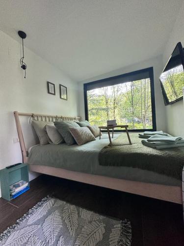 Postel nebo postele na pokoji v ubytování Tiny House 4 Two