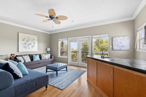 a kitchen and living room with a couch and a table at Brand New Lake Travis Estate - Awesome Pool in Austin