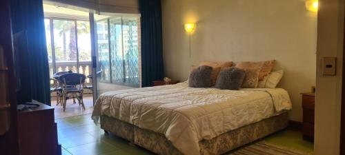 En eller flere senge i et værelse på Departamento en primera línea del mar