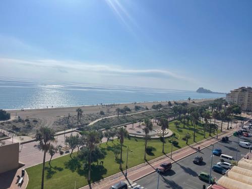 a view of a street with a beach and the ocean at Penismar Magic in Peniscola
