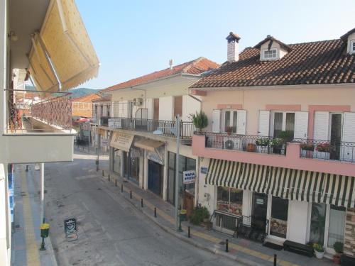 an empty street in a town with buildings at One Home ~ Fits All in Mouzákion