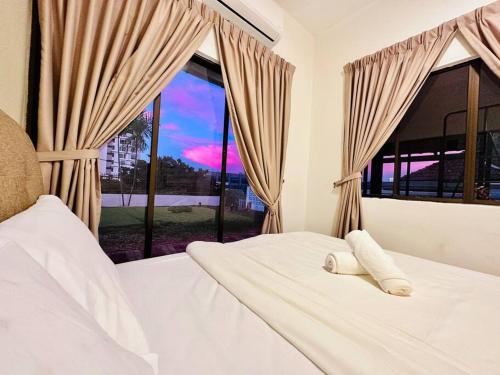 a bedroom with a bed and a large window at (New) Beachside Antique Villa@14 pax in George Town