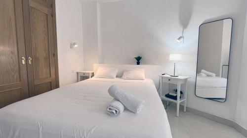 Ένα ή περισσότερα κρεβάτια σε δωμάτιο στο Nuevo con Piscina y Parking en la Playa