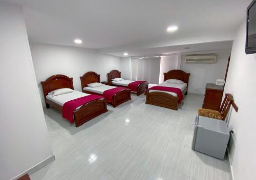 Een bed of bedden in een kamer bij Hotel Exelsior