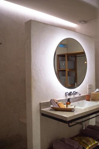 a bathroom with a sink and a mirror at Casa Antonieta in Oaxaca City