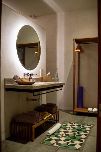 a bathroom with a sink and a mirror at Casa Antonieta in Oaxaca City