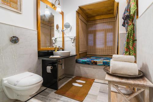 a bathroom with a toilet and a sink at Hotel Jasmin Home in Jaisalmer