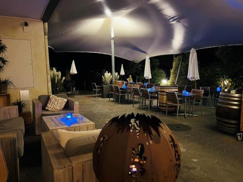 a large tent with tables and chairs in a patio at Vinum at Felmis SELF CHECK-IN in Luzern