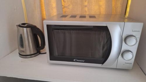 a microwave sitting on top of a counter at STUDIO LOFT MEDINA AVEC TERRASSE in Marrakech