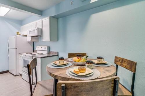 a kitchen with a table with food on it at Seaside Boutique Hotel, Waves At Your Doorstep in Port Aransas