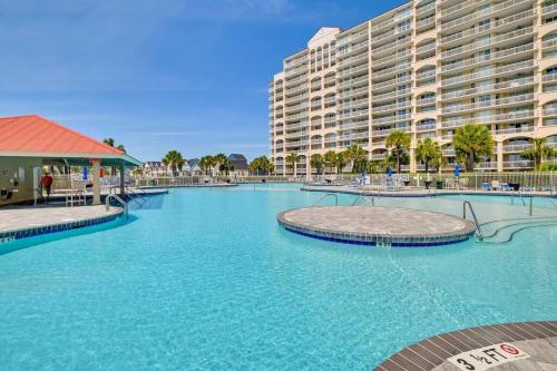 a large swimming pool in front of a large building at Barefoot Resort & Golf. Near Barefoot Landing. in North Myrtle Beach