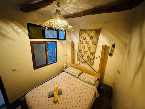 Un pat sau paturi într-o cameră la Chiwash Place Taghazout