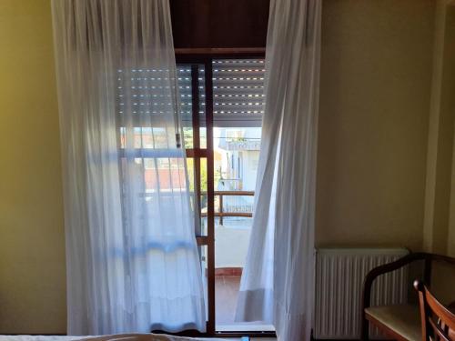 Ένα ή περισσότερα κρεβάτια σε δωμάτιο στο Hotel Peninsular
