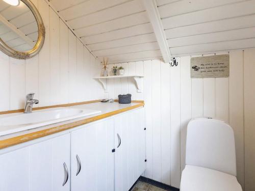 a bathroom with a sink and a toilet at Holiday home Tranekær XVIII in Tranekær