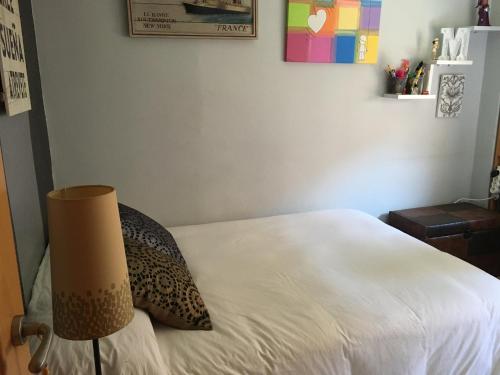 Ένα ή περισσότερα κρεβάτια σε δωμάτιο στο Habitación particular,baño compartido