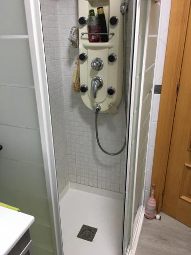 a shower with a sink in a bathroom at Habitación particular,baño compartido in Zaragoza
