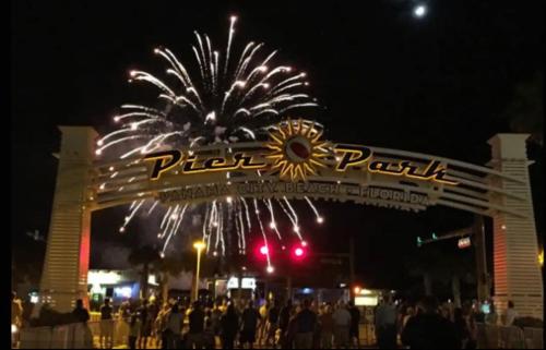 a fireworks display in front of a building with people at New Listing: Water Views, Beach, West end near 30A in Panama City Beach
