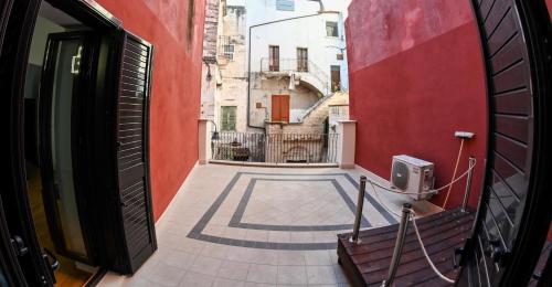 a view of an alley from a balcony of a building at Dimora Notar Domenico -GRAVINA IN PUGLIA- in Gravina in Puglia