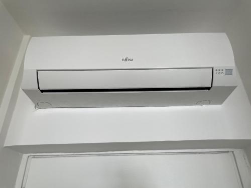 a white stove top oven in a ceiling at A Window to the Sea in Nettuno