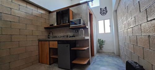 a kitchen with a counter and a sink in a room at YAXCHILAN 27 in Cancún