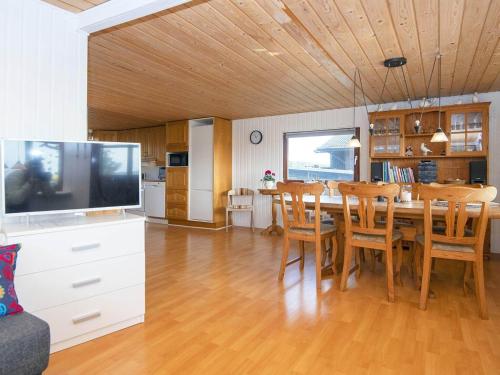 a kitchen and dining room with a table and chairs at 8 person holiday home in Aabenraa-By Traum in Aabenraa
