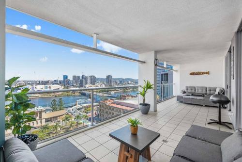 a living room with a view of a city at Dress Circle! 2Bed/2Bath/1Car/Amazing Views ~ CBD in Brisbane