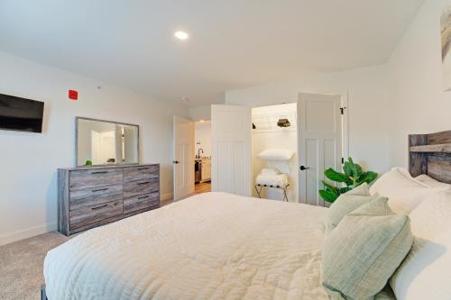 a white bedroom with a large bed and a dresser at Cozy Escape with Modern Comfort in Central Auburn - 1BD, 1BA Apartment in Auburn
