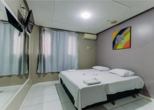 Postel nebo postele na pokoji v ubytování Iapi Hotel