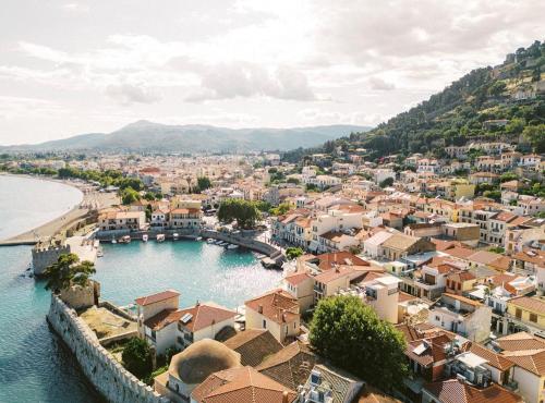 an aerial view of a town with a body of water at Wisteria in Nafpaktos