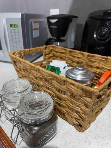 a basket sitting on a counter next to a coffee maker at Puerta Azul in Tampico