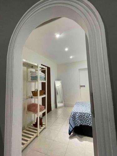 an archway in a room with a bedroom at Puerta Azul in Tampico