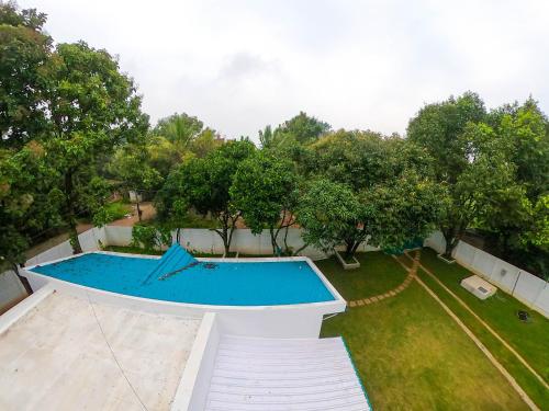 an overhead view of a swimming pool in a yard at The Perfect Hideout in Yelahanka