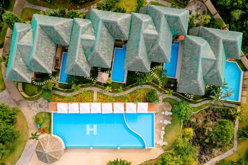 an overhead view of a villa with a swimming pool at H Resort Bohol - The Coral Cliff by SMS Hospitality in Calape