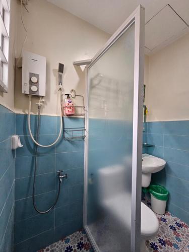 a bathroom with a shower and a toilet at Casa Nayah Cebu City Transient Entire Home in Cebu City