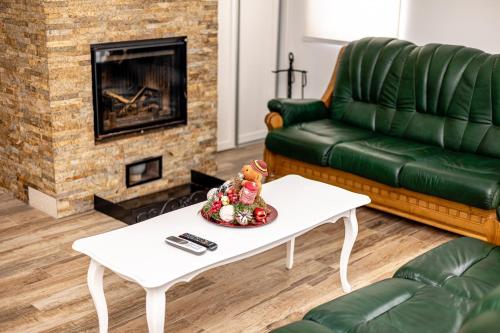a living room with a couch and a coffee table at ForS Konak Apartments in Belgrade