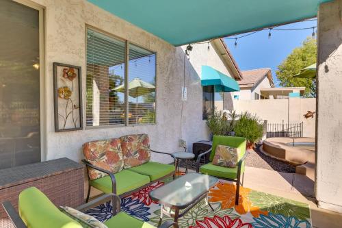 a patio with chairs and a table on a patio at 5 Mi to State Farm Stadium Home with Private Pool! in Avondale