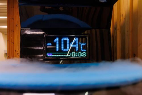 a close up of a clock with the time on it at Lucky Bansko Aparthotel SPA & Relax in Bansko