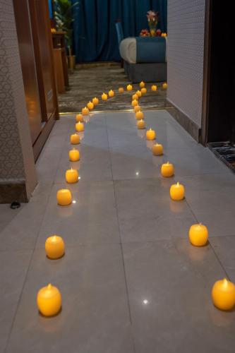 a row of orange balls on the floor at Paradise Inn Jeddah Hotel in Jeddah