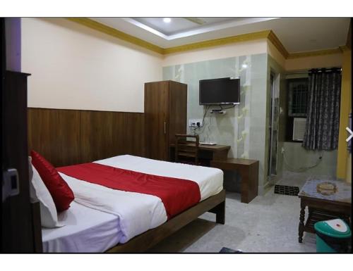 מיטה או מיטות בחדר ב-Mahodadhi Guest House, Paradeep, Odisha