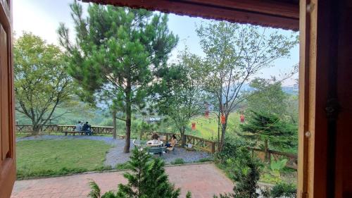 a view of a yard from a window of a house at Pea homestay in Sa Pa