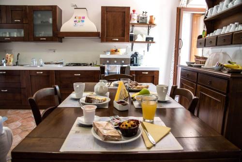 a kitchen with a table with food on it at B&B Al Casalicchio in Foria