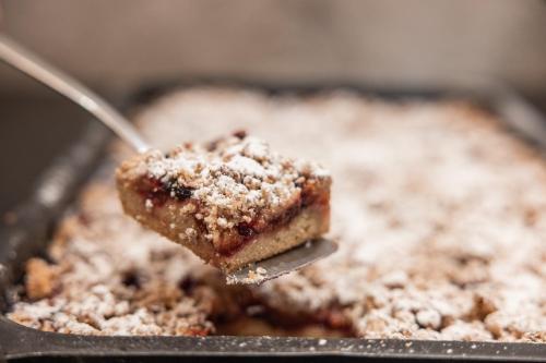 a piece of dessert with a spoon in a pan at Biohotel Leutascherhof in Leutasch