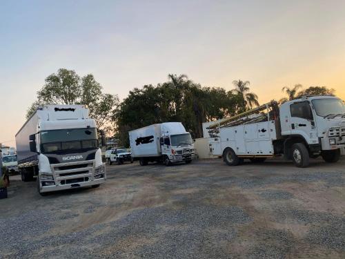 a group of trucks parked in a parking lot at Top 1 Motel in Rockhampton