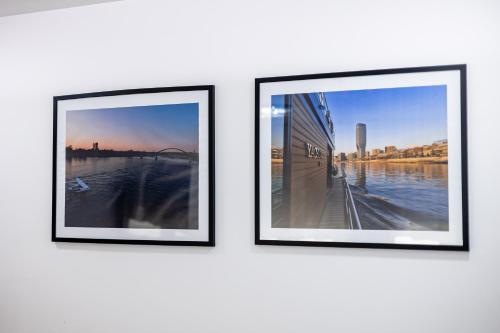 three framed photographs hanging on a wall at ForS Resort & Spa in Belgrade