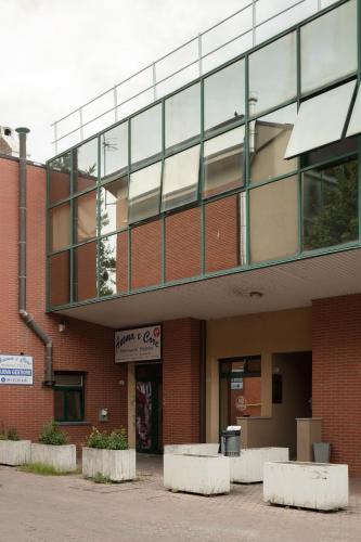 an outside view of a brick building at FrenkHome open space in Riolo